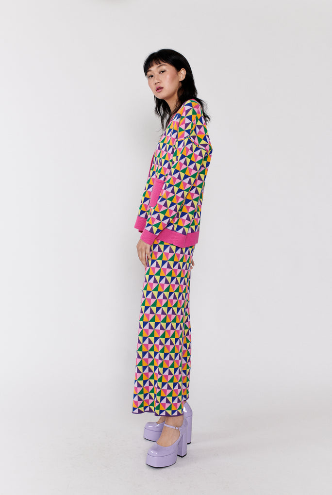 Model wears Origami pattern wide leg knitted trouser from Olivia Rubin